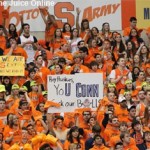 Syracuse's crowd at the Carrier Dome holds up signs during a timeout