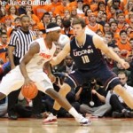 Syracuse forward CJ Fair drives against UConn's Tyler Olander