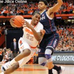 Syracuse forward Kris Joseph drives against UConn