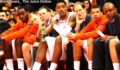 Syracuse center Fab Melo looks on from the bench