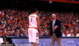 Syracuse coach Jim Boeheim and guard Michael Carter-Williams speak to each other