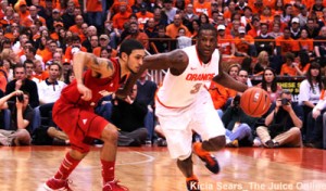 Syracuse guard Dion Waiters drives against Louisville guard Peyton Silva