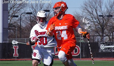 Syracuse midfielder Kevin Drew brings the ball up