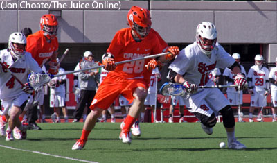 Syracuse long stick midfielder Peter Macartney goes after a loose ball
